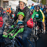 woman with son on bike